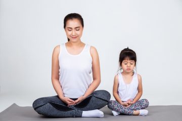 mom and toddler doing meditation